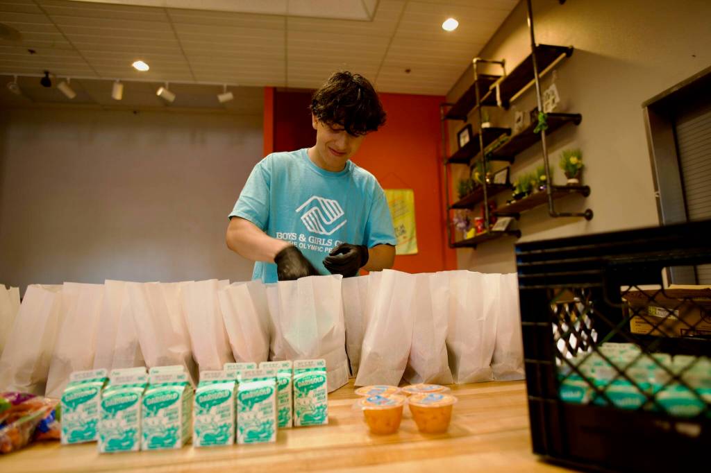 Isaac Edgecomb worked for the Sequim Boys & Girls Club's summer food program over the past two summers, helping to fill paper bags with lunches and assisting in their distribution.
