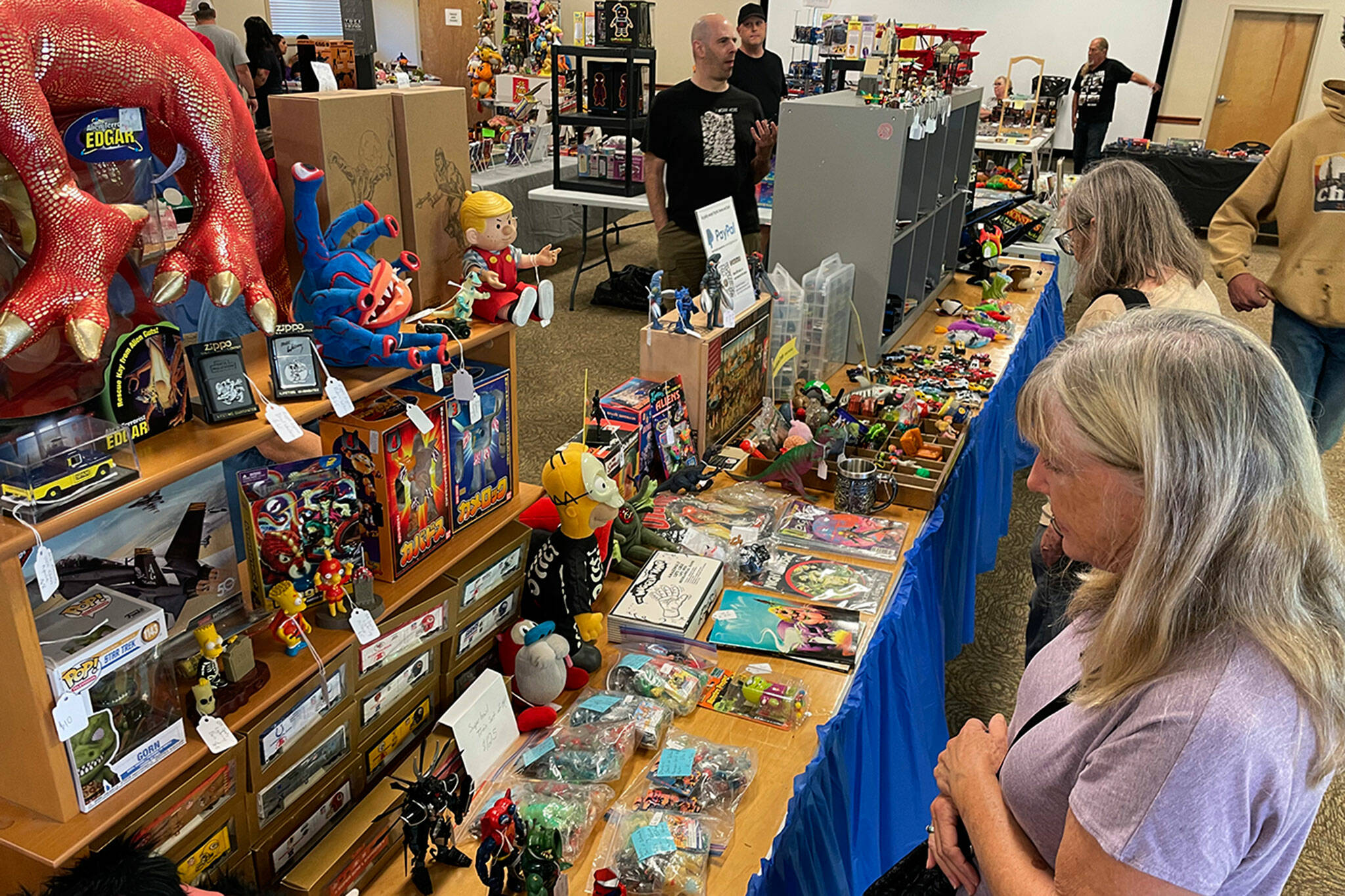 Sequim Gazette file photos by Matthew Nash
The Olympic Peninsula Toy and Collectibles Show organizer Corey Edwards, pictured at top in the events first year, said the events second year was a success and this year they have 35 tables of toys for sale from 23 vendors at the Guy Cole Event Center on Aug. 30.