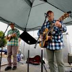 Photos by Jacques Star
The Free Rangers perform some folk originals at the Olympic Peninsula Air Affaire, with Kevin Lee Magner on guitar and Steve Lopes on mandolin and electric bass.