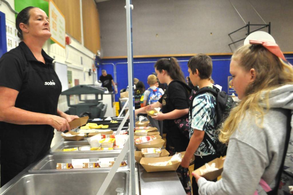 Sequim Gazette photo by Matthew Nash/ Students find their way through the breakfast line at Helen Haller Elementary on Aug. 27, the first day of classes.