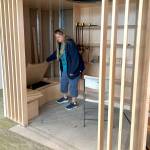 Sequim Gazette photo by Matthew Nash/ Jennifer Pelikan, a NOLS trustee representative from the West End, takes a peek inside a book nook of the Sequim Librarys childrens area.