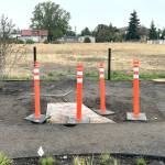 Sequim Gazette photo by Matthew Nash/ A donation for a flagpole from Brad Littlefield will honor his late friend and fellow library supporter John P. Smith. A small plaque will be placed at its base.