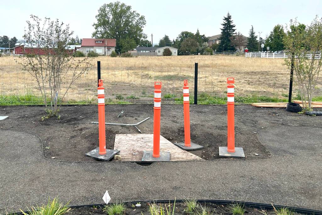 Sequim Gazette photo by Matthew Nash/ A donation for a flagpole from Brad Littlefield will honor his late friend and fellow library supporter John P. Smith. A small plaque will be placed at its base.