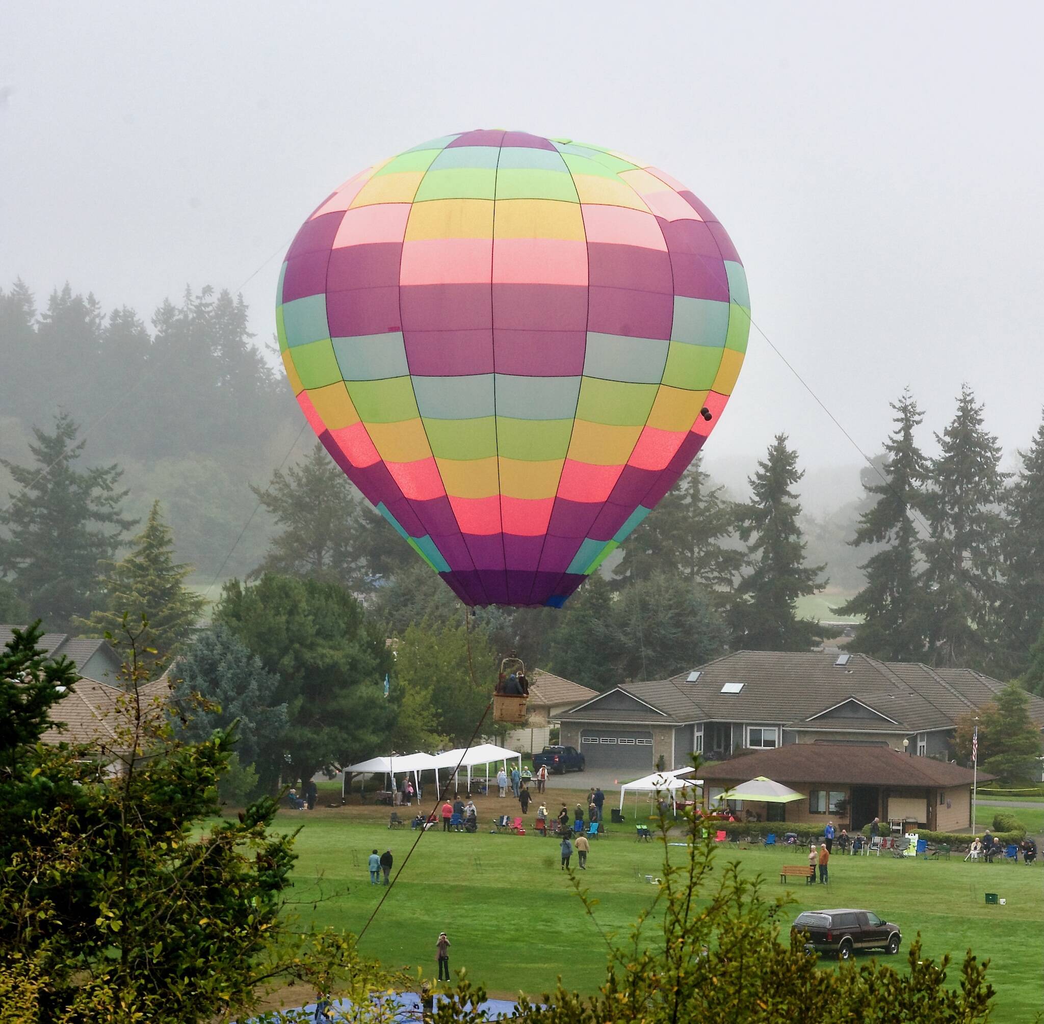 Captain Crystal Stouts Dream Catcher hot air balloon rises above a community picnic on Saturday at Sunland. A third-generation balloonist, Stout has been flying hot air balloons for 40 years. Her nonprofit offers free hot air balloon rides to veterans.