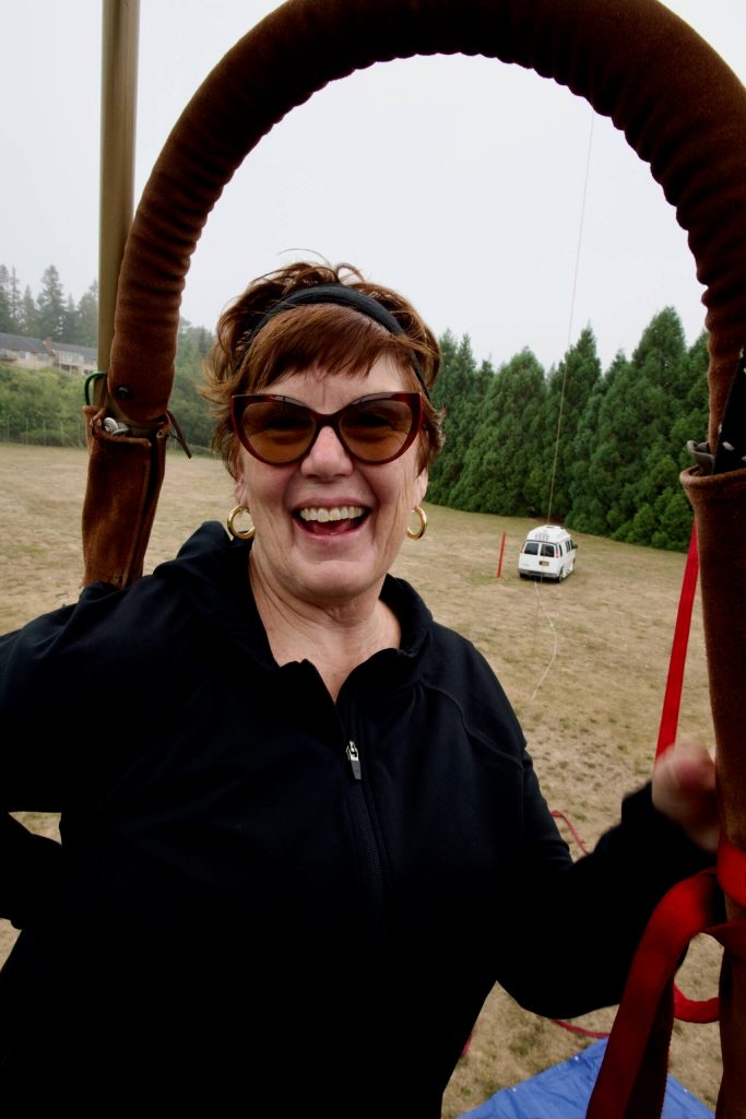 Laura Seiler is all smiles as she gets a bird's eye view of Sunland from the basket of the tethered Dream Catcher hot air balloon.