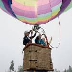Captain Crystal Stout, left, takes Sunland residents Susan Drake, center, and Drakes sister Kim Koons aloft in her tethered hot air balloon during a community picnic Saturday, Sept. 6.