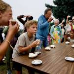Haley Dyck, left and her brother Callum Dyck participate in a pie-eating contest Saturday at Sunland as judge and moderator Don Harris (in yellow vest) keeps a close eye on competitors. It was intense, Harris said of the friendly competition.