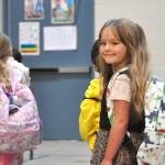 Sequim Gazette photo by Matthew Nash/ Mazie Hanning is all smiles on her first day of kindergarten at Greywolf Elementary as she walks to her teacher Amy Skogsbergs classroom.