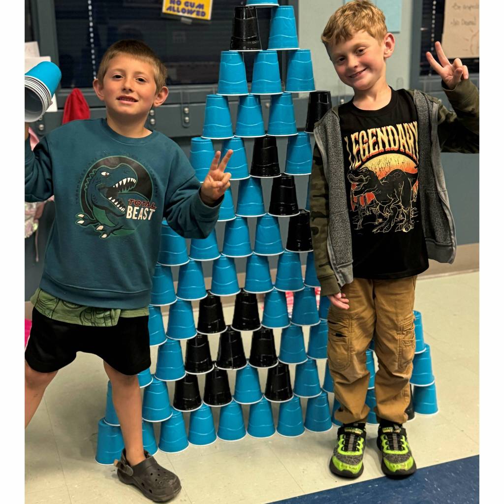 Photo courtesy of the Boys & Girls Clubs of the Olympic Peninsula/ Brandon Layman, left, and Jaxon Dunn celebrate their achievement in the Project L.A.N.E. Stack Attack challenge.