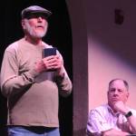 Sequim Gazette photo by Matthew Nash/ Rev. Jeremiah Brown (Ken Burland) prays for the conviction of teacher Bert Cates for teaching evolution during a rehearsal of in Inherit the Wind as attorney Henry Drummond (Steve Rodeman) watches.