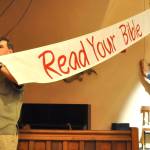 Sequim Gazette photo by Matthew Nash/ A banner encouraging visitors to the courthouse in Read Your Bible goes up in Inherit the Wind.