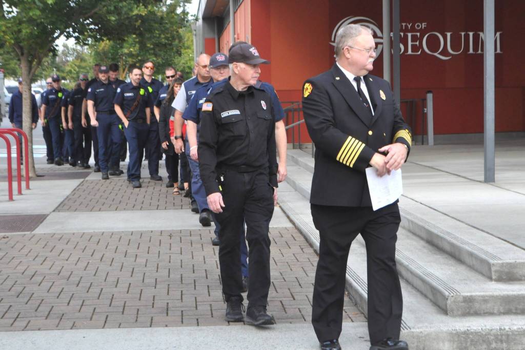 Sequim Gazette photo by Matthew Nash
First responders walk to a 9/11 Remembrance Ceremony in the Sequim Civic Center plaza.