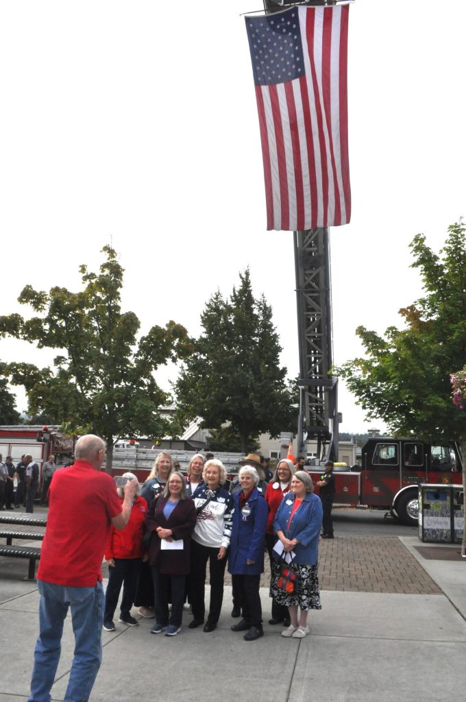 Sequim Gazette photo by Matthew Nash/ Some members of the Michael Trebert Chapter of the Daughters of the American Revolution in Sequim stand together for a photo-op at the 9/11 Remembrance Ceremony.