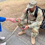 Photo courtesy Michael Trebert Chapter DAR/ A service member receives a protein snack from a member of the Michael Trebert Chapter, DAR.