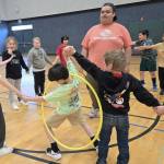 Photo courtesy of the Boys & Girls Clubs of the Olympic Peninsula
Youth Development staffer Aymon Anderson leads a group of elementary school children in a hula hoop challenge as part of the Sequim Boys & Girls Clubs Project L.A.N.E.