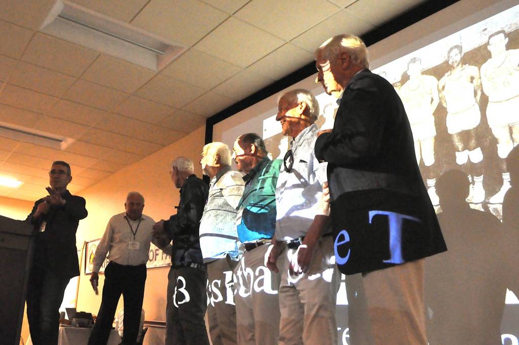 Sequim Gazette photo by Matthew Nash/ Some of the members of Sequim High Schools 1963 basketball team gather on stage to accept being inducted into Sequim High Schools Hall of Fame.