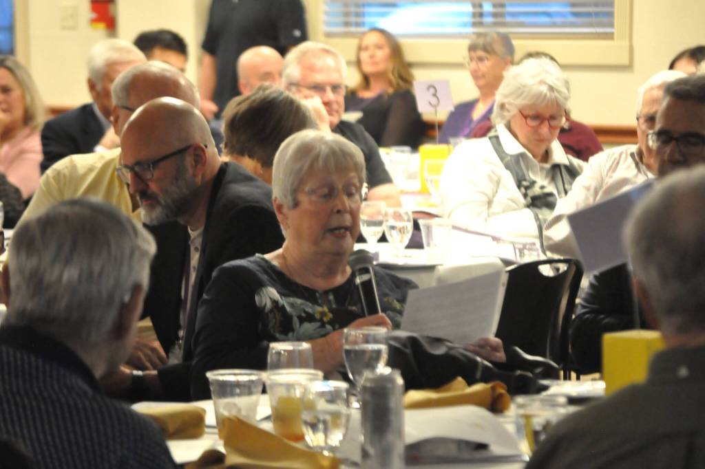 Sequim Gazette photo by Matthew Nash/ Roenah Blank, a classmate of Dick Ballard from the Sequim High School Class of 1955, reads his thank you to letter for being accepted to the Sequim High School Hall of Fame.
