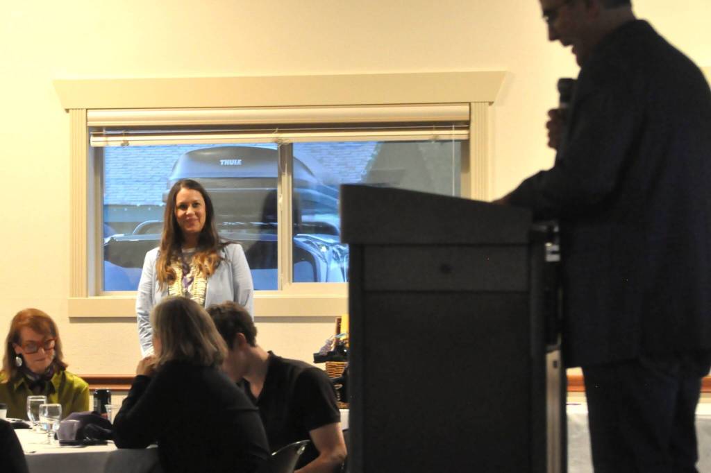 Sequim Gazette photo by Matthew Nash/ Lisa (Fryer) Tuiasosopo, a 2025 Sequim High School Hall of Fame inductee, listens to JD Angiuli list off her accomplishments on and off the field before she is inducted into the Hall of Fame.