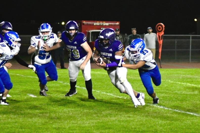 Sequim Gazette photo by Jacques Star/ Wolves running back Liam Wiker runs for positive yards to add to his 93 yards rushing against Elma.