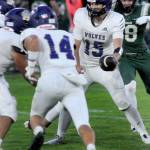 Photo by Keith Thorpe, Olympic Peninsula News Group/
Sequim quarterback Kaden Miller readies a hand-off against Port Angeles on Sept. 26 in Port Angeles.