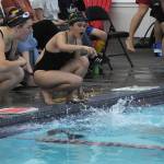 Sequim Gazette photo by Matthew Nash/
Sequim swimmers Madelyn Bower and Grace Bravo cheer for a teammate during a match against Klahowya on Sept. 24 in the Sequim YMCA.