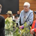 Sequim Gazette photo by Matthew Nash/ Pam Foss and Donna Criscione visit various booths at the Dungeness River Festival, including the Clallam County Noxious Weed Boards booth. It was their first time visiting the festival, they said. Its good to see all these kids here, Foss said.