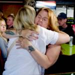 Cheryl Hales gives Jennifer Hanshaw a hug as Mike Marger, left, looks on during a fundraiser at Rainshadow Cafe to help pay medical expenses for Hanshaws daughter, Ember.
Sequim Gazette photo by 
Jacques Star 
Cheryl Hales gives Jennifer Hanshaw a hug during a fundraiser at Rainshadow Cafe to help pay medical expenses for Hanshaws daughter, Ember.
Sequim Gazette photo by Jacques Star