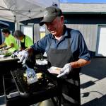 Sequim Gazette photo by Jacques Star/
Mike Hanson with Sequim Sunrise Rotary prepares crabless cakes for Sequim Food Banks Everyone at the Table fundraiser.