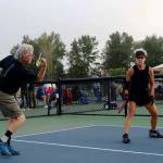 Don Church and Pauline Geraci play an energetic set of mixed doubles during the Sequim Picklers recent Blue Hole Bash pickleball tournament. The round-robin matches included mens and womens singles and doubles as well as mixed doubles at several skill and age levels.