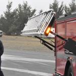 Sequim Gazette photo by Matthew Nash/
Firefighter/ Paramedic Bryant Kroh with Clallam County Fire District 3 looks at the ladder attachment on one of the districts new fire engines that arrived in recent weeks.