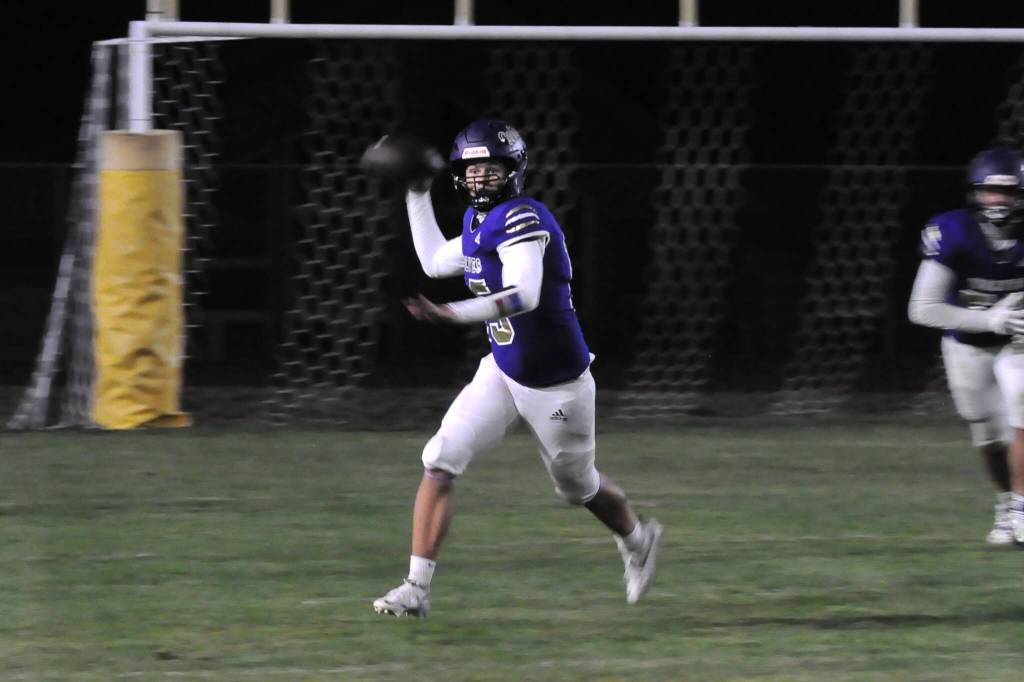 Sequim Gazette photo by Matthew Nash
Sequim quarterback Kaden Miller looks to pass during the Homecoming game on Oct. 3 for the Wolves.