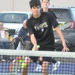 Sequim Gazette photo by Matthew Nash
Zach Post returns a ball as doubles teammate Ryan Stites looks on in an Oct. 2 match with North Mason. The No. 3 doubles team won 6-1, 6-3.