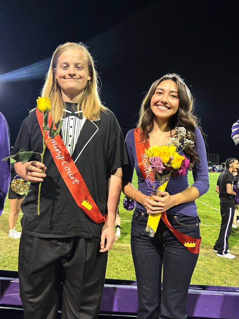 Sequim Gazette photo by Matthew Nash/ Sophomores Reid Spaulding and Marelys Gonzalez smile after being announced as the representatives of their class at the Homecoming royalty court.