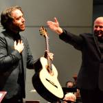 Photo courtesy Diane Urbani de la Paz
Guitar soloist Colin Davin, left, takes a bow following his performance with the Port Angeles Symphony and conductor Jonathan Pasternack in 2021. Davin returns for two solo recitals this week in Port Angeles and Sequim.