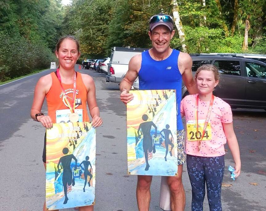 Photo by Pierre LaBossiere, Olympic Peninsula News Group/
From left, Sarah Paquet of Bothell, John Mauro and Madeline Bartos-Mauro, both of Port Townsend, were all winners at the Spruce Railroad Trail 5K/10K. Paquet won the womens 10K while Mauro won the mens 10K. Bartos-Mauro, age 10, won her age 10-14 group.