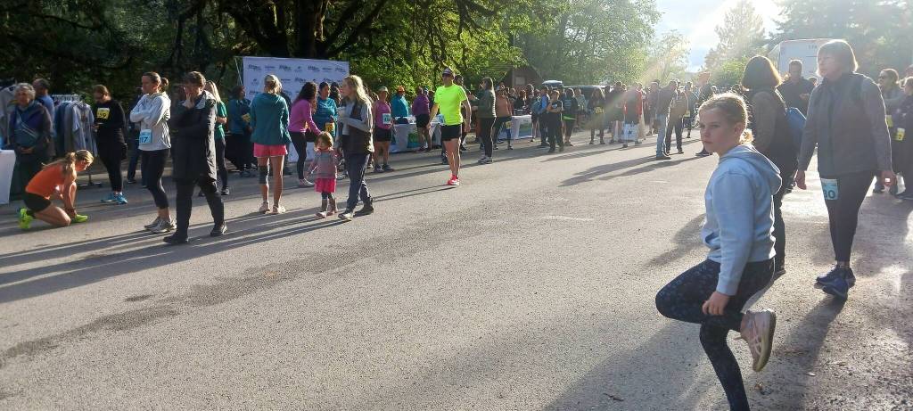 Photo by Pierre LaBossier, Olympic Peninsula News Group/
Runners get loose at the starting line before the beginning of the Spruce Railroad Trail 5K/10K.