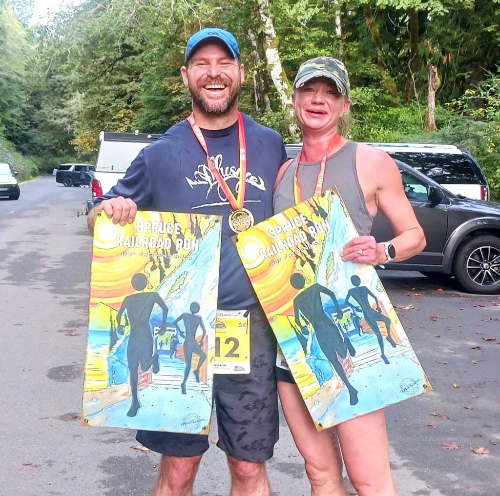 Photo by Pierre LaBossiere, Olympic Peninsula News Group/
Matt and Janae Dale of Bremerton were the mens and womens winners of the Spruce Railroad Trail 5K on Saturday.