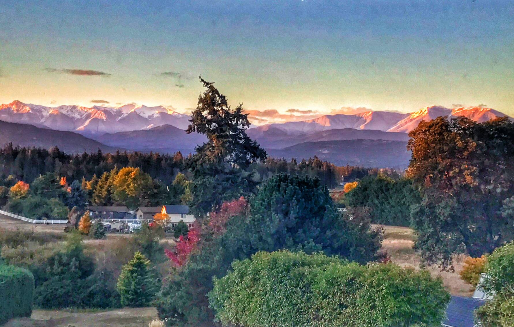 The first snowfall of the season can be seen atop the Olympic Mountains in this photo taken in Sequim by contributor Bob Lampert.