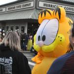 Sequim Gazette file photo by Matthew Nash/
An inflatable Garfield awaits the stoplight change at Centennial Place on Halloween in downtown Sequim in 2024. Downtown merchants host trick-or-treating from 3-5 p.m. on Halloween.