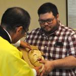Sequim Gazette photo by Matthew Nash/
Shiso City Deputy Mayor Kenji Tomita presents Sequim Mayor Brandon Janisse one of three masks during the Oct. 13 Sequim City Council meeting. The traditional Japanese performing arts masks represent friendship, connection and happiness and will be in the Sister City display case with more detailed information inside the Sequim Civic Center in the near future, staff said.