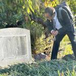 Sequim Gazette photo by Matthew Nash/
Shiso City Deputy Mayor Kenji Tomita admires a donor plaque of Japanese residents who helped fund construction and maintenance of the Friendship Garden in Carrie Blake Community Park.
