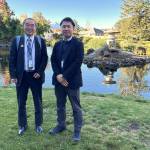 Sequim Gazette photo by Matthew Nash/
Shiso City delegates Deputy Mayor Kenji Tomita and Satoshi Ishihara with the Planning and Coordination Department stand near the lantern made by a Japanese artist from their city in 1997. It was donated and installed in the Sequim-Shiso Friendship Garden and remains a popular attraction in Carrie Blake Community Park.