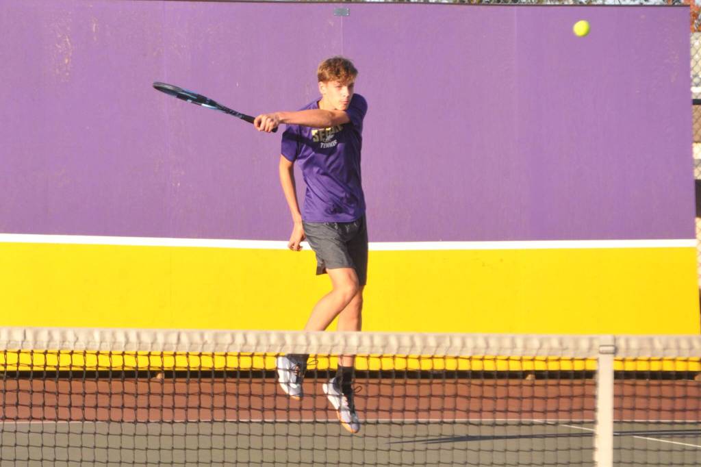 Sequim Gazette photo by Matthew Nash/
Bjorn Henrickson returns a hit in a match with partner Mason Rapelje, not pictured, Oct. 15 against Kingstons No. 1 doubles team.