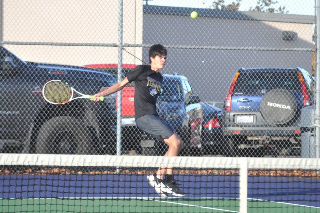 Sequim Gazette photo by Matthew Nash/
Zach Post, playing as No. 2 singles on Oct. 15, returns a hit against a Kingston player.