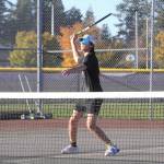 Sequim Gazette photo by Matthew Nash/
Wyatt Perez looks to make a strong hit against Kingston playing as the Wolves No. 3 singles player.