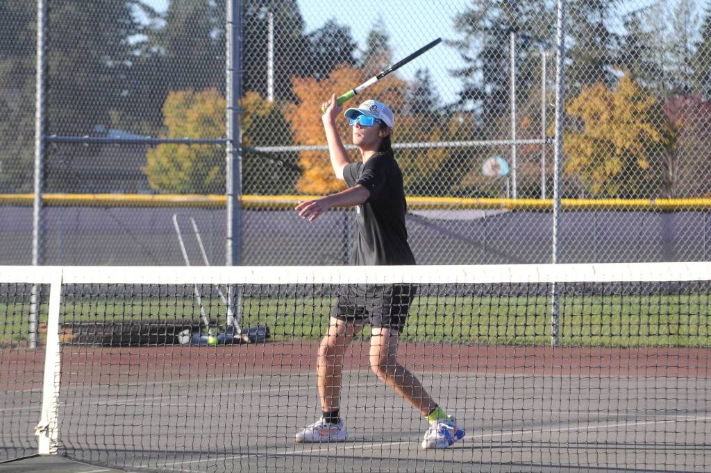Sequim Gazette photo by Matthew Nash/
Wyatt Perez looks to make a strong hit against Kingston playing as the Wolves No. 3 singles player.
