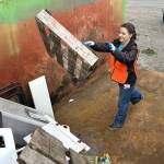 Sequim Gazette photo by Matthew Nash/
Frances Haskins, a freshman at Sequim High School and a member of the Interact Club, helps fill a dumpster for Rally in the Alley on Oct. 18 at the City of Sequims City Shop.
