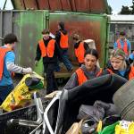 Sequim Gazette photo by Matthew Nash/
Members of the Sequim Interact Club, including seniors Willa Gradillas and Shelby Haskins, in front, help unload one of dozens of vehicles on Oct. 18 during the Rally in the Alley at the Sequim City Shop.