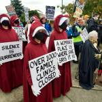 Sequim Gazette photo by Jacques Star/ 
Some participants in the No Kings II protest in Sequim wore Handmaids Tale costumes to draw attention to threats against womens rights.