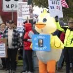 Photos courtesy John Gussman/
Many of those who participated in the No Kings II demonstration on Saturday, Oct. 18 carried signs. Some even wore costumes.